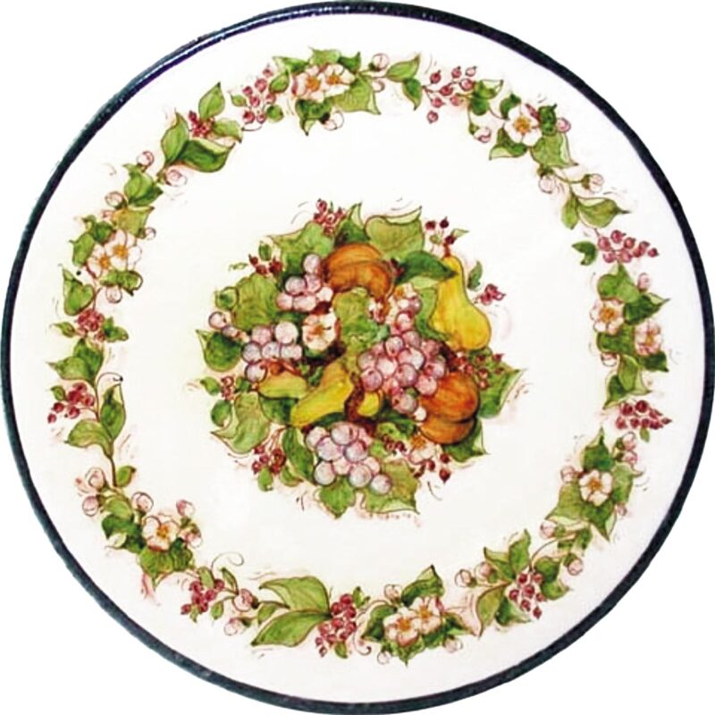 round lava stone table with flower and fruit decoration